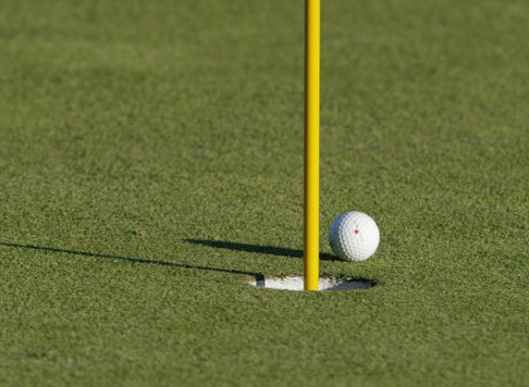 A Single Golf Ball on the Green